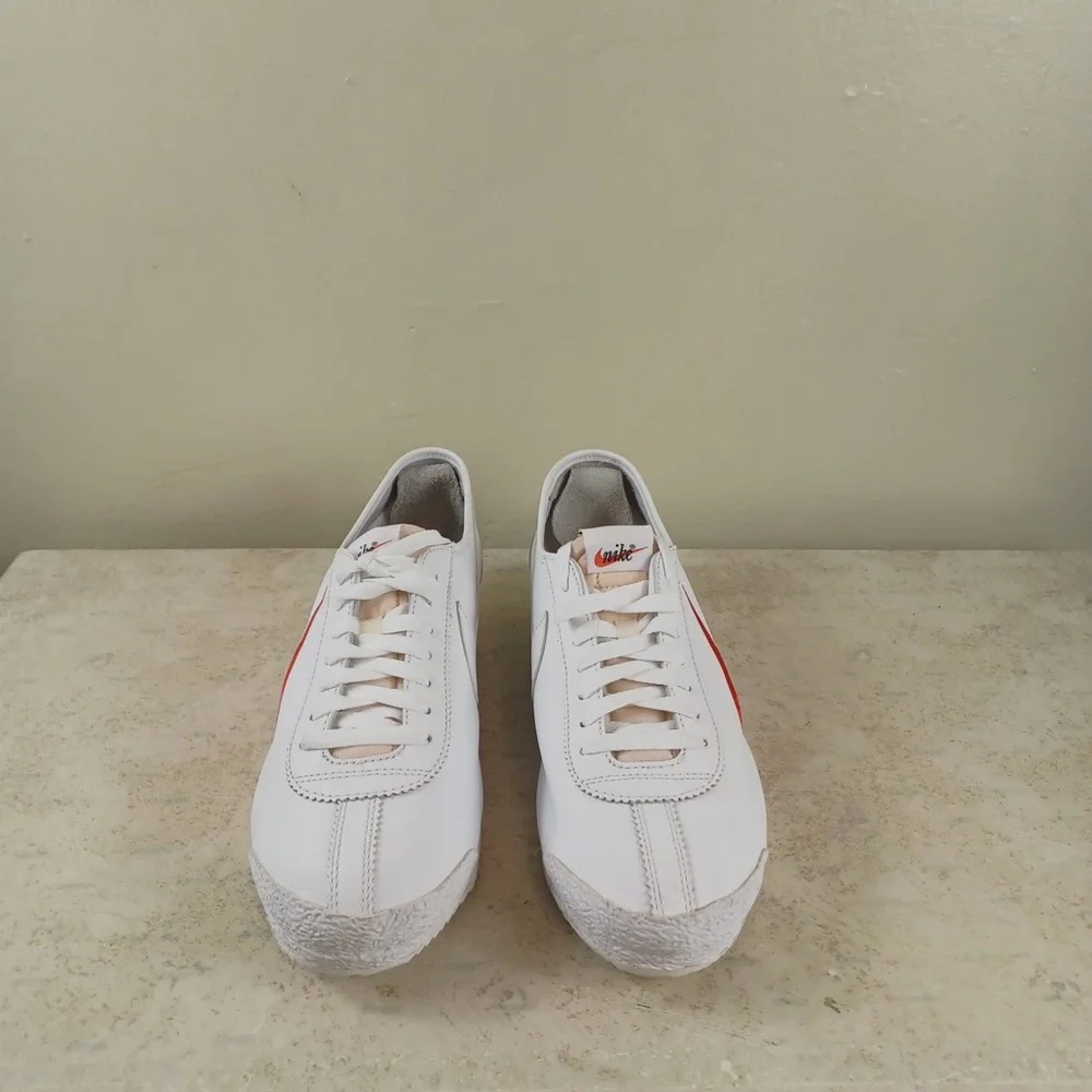 Nike White Sneakers with Red Swoosh and Blue Outsole Trim